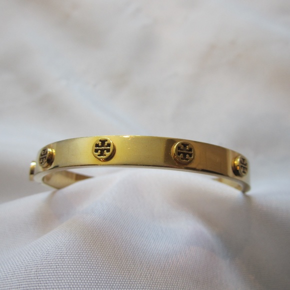 Tory Burch Jewelry - Tory Burch Gold Raised Logo Metal Hinged Bracelet